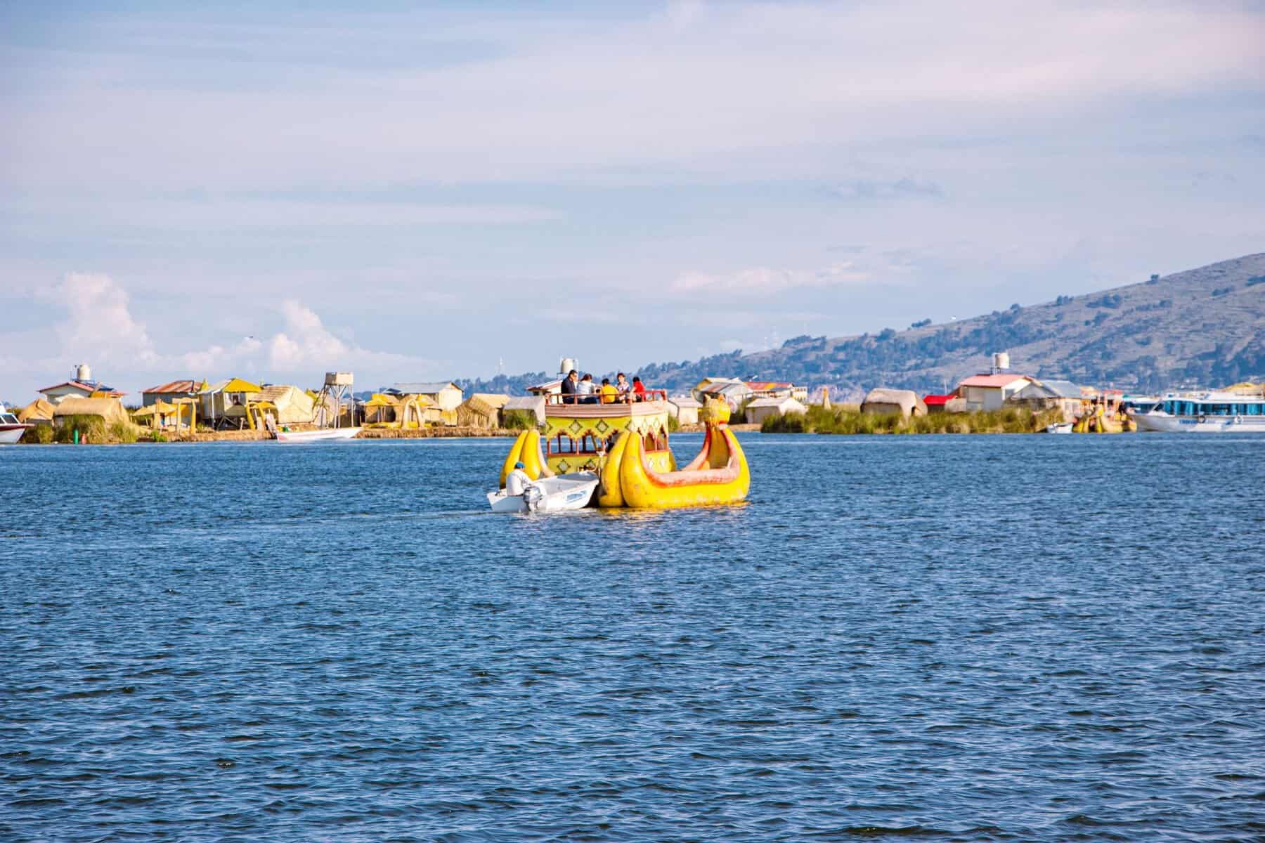 Reed boats near the Uros floating islands on Lake Titicaca, Peru