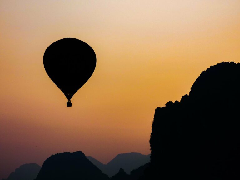 A hot-air balloon at sunrise over Vang Vieng