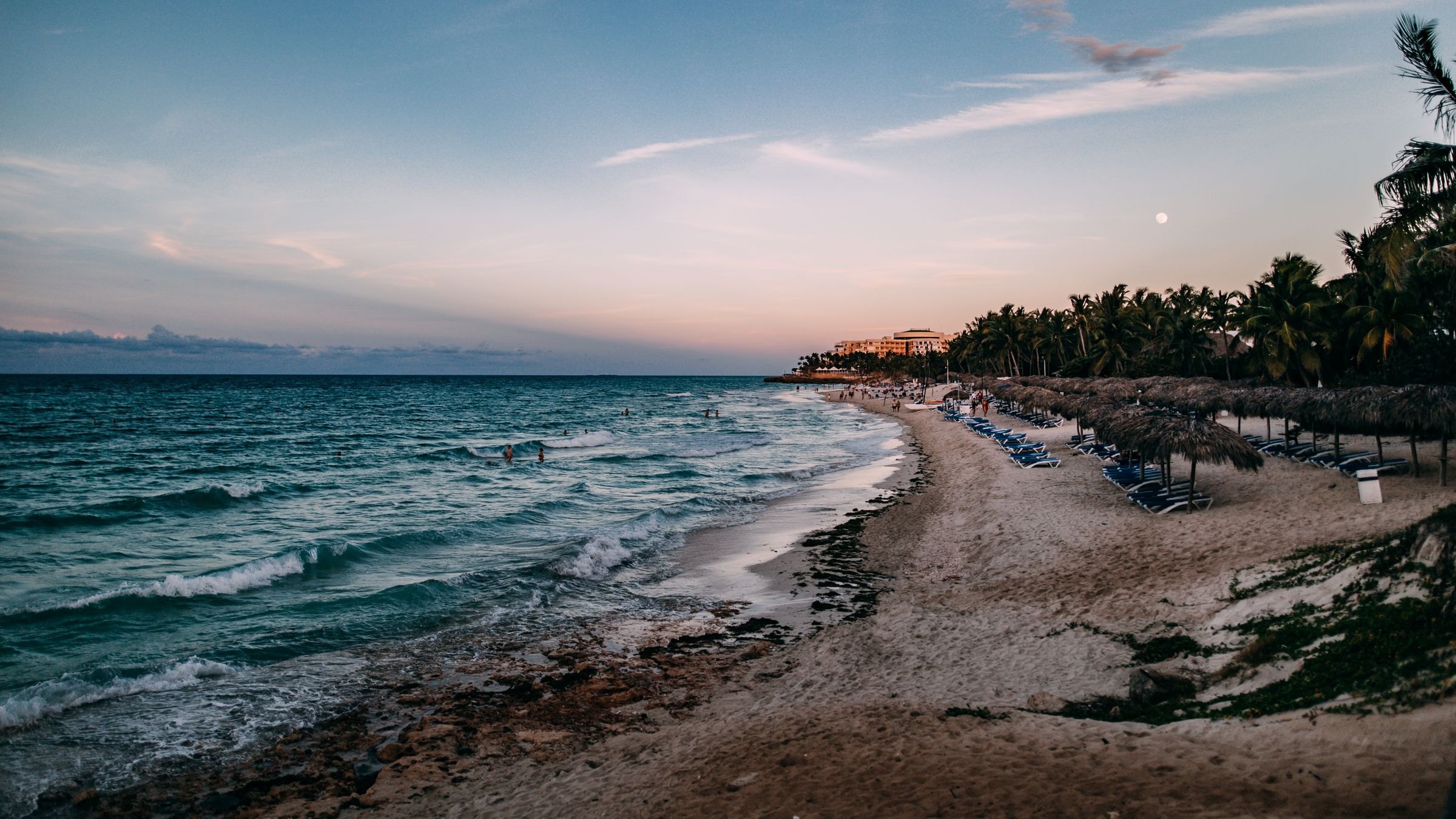 Varadero beach and palm trees at sunset