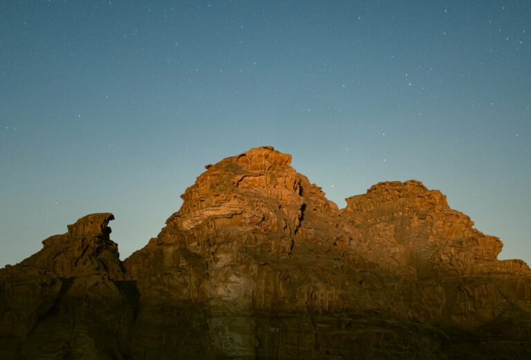 Rock formations of Wadi Rum under a starry sky