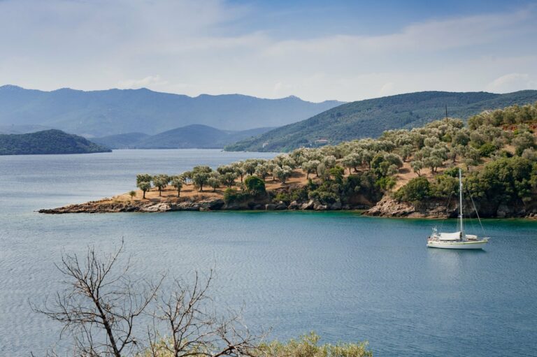 A yacht anchored in a quiet Greek bay