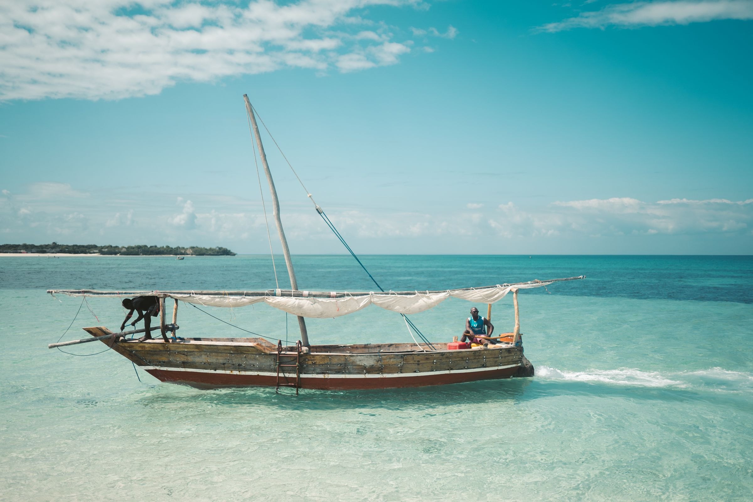 Fishermen sailing a dhow off Zanzibar