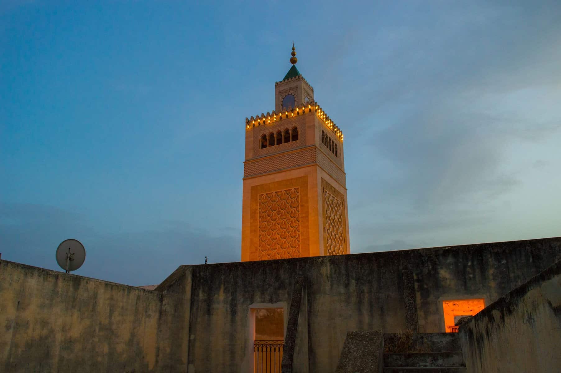 The minaret of the Al-Zaytuna Mosque in the Tunis medina at dusk